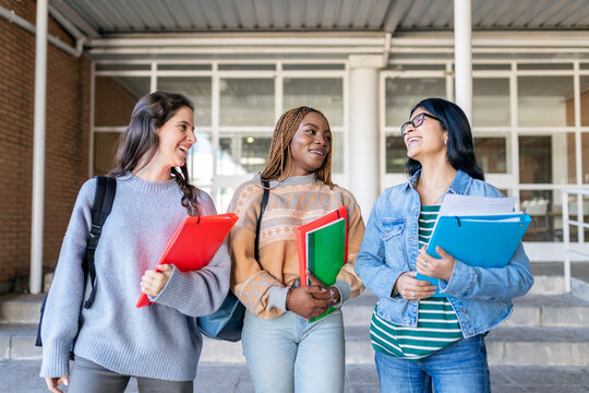 Female classmates leaving class in high school