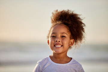 Girl, child and happy with portrait on beach for outdoor fun, travel and tourism on vacation for summer break of semester. Female kid, mock up and carefree on holiday in Australia for sunny adventure