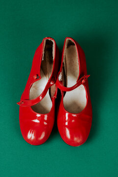 pair of used red patent leather flamenco shoes 