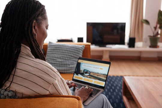 Woman planning a travel with laptop