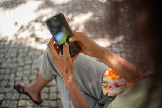Close up of hands texting on phone screen