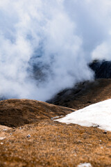 Snow-Capped Peaks Piercing the Clouds