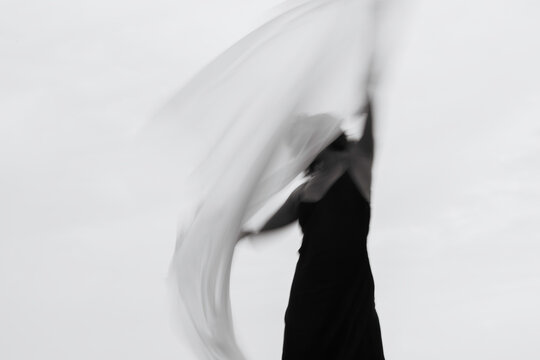 Abstract female dance on beach in sunrise