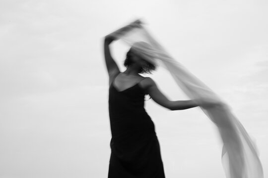 Abstract female dance on beach in sunrise
