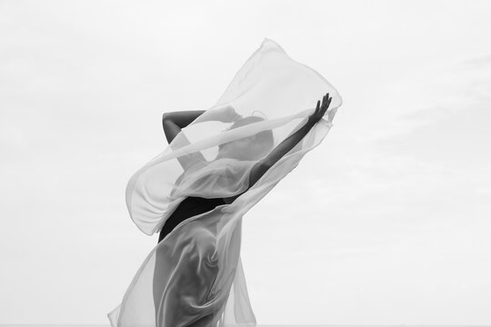 Abstract female dance on beach in sunrise