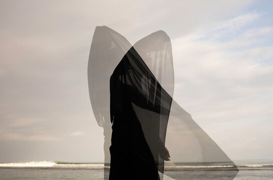Abstract female dance on beach in sunrise