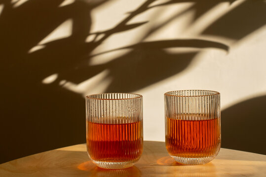 Two glasses with tea on the table