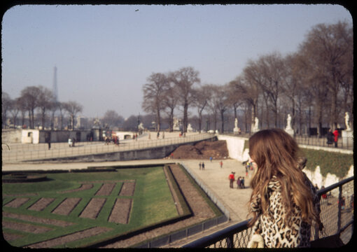 70's Old analog photo. Young woman in front of Versailles Garden