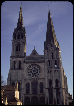 70's film photo. Facade of Gothic Chartres Cathedral in France.