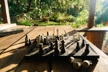 Chess board on the patio lit by sunset light