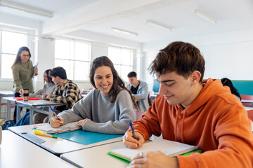 students smiling and studying in classroom