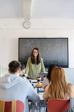 teacher teaching mathematics to the students