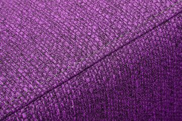 Textured pink furniture fabric with stitching
