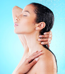 Woman, washing hair or showering in blue studio background for cosmetics, hygiene and wellness,...