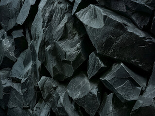 Close-up of jagged, black rocks with a rough, textured surface