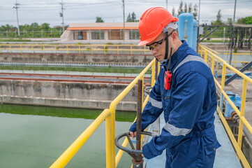 Water plant maintenance technicians, mechanical engineers check the control system at the water treatment plant.