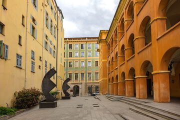 Rusca barracks (Caserne Rusca or Palais Rusca) was built in 1775 to house garrison of the city, today it is Court of Instance in Nice. Next is Clock Tower (Tour de l'Horloge, 1718). Nice, France.