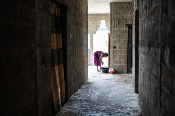 Senegalese Woman Washing Dishes