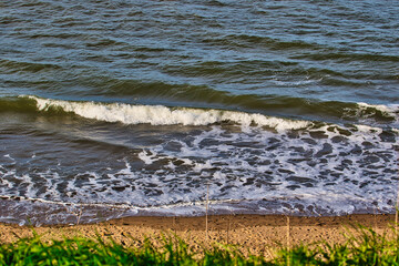 Ocean waves crashing onto a sandy beach