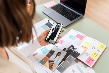 Woman Reviewing Fashion on Smartphone