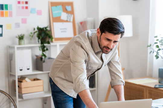 Concentrated Male Professional at Desk