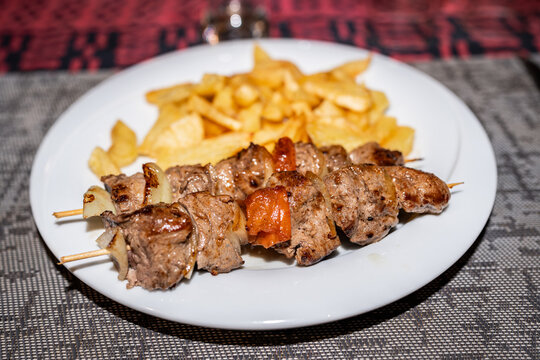 meat brochette with potatoes