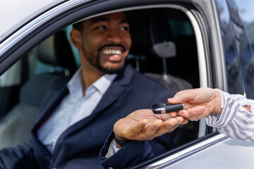 Businessman happy to receive new car keys