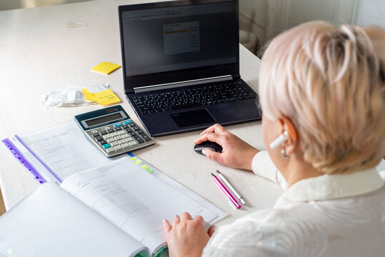 Businessman working in office with documents and office equipment