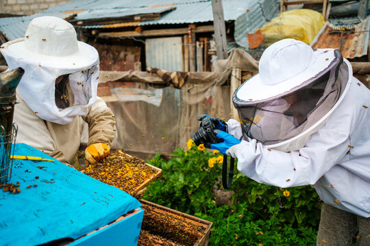 Photographer Capturing Beekeeper hard work