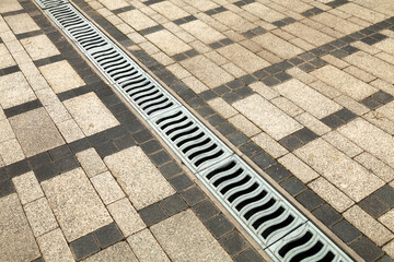 Drainage element, storm drainage on a paved area or road. The system channel (tray) is covered with...