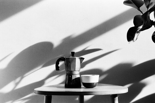 Geyser coffee maker and a cup