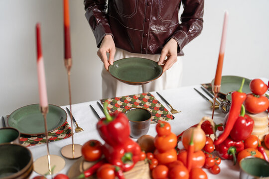 Decorator is decorating table in luxury style