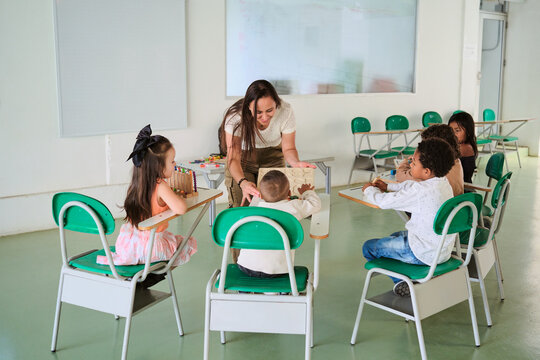 Latina teacher sharing with her students