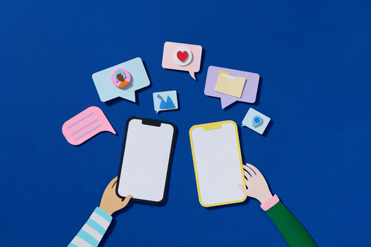 Paper cut style smartphone with chatting bubble on social media