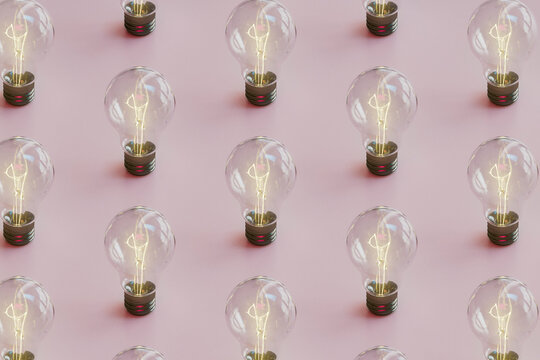 Pattern of Illuminated Light Bulbs on Pink Background