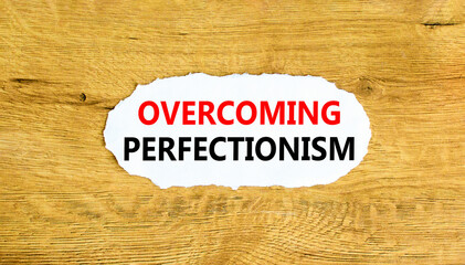 Overcoming perfectionism symbol. Concept words Overcoming perfectionism on beautiful white paper....