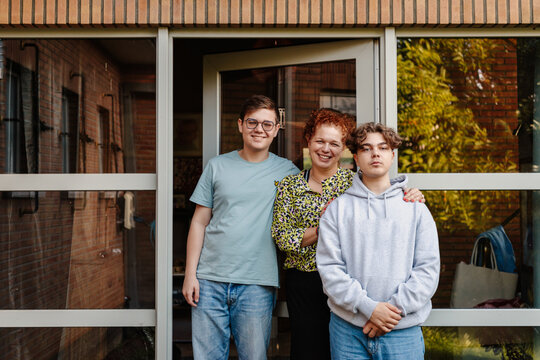 Family portrait in front of family home