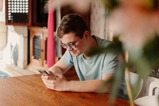 Connected Youth: Teenager Engrossed in Smartphone