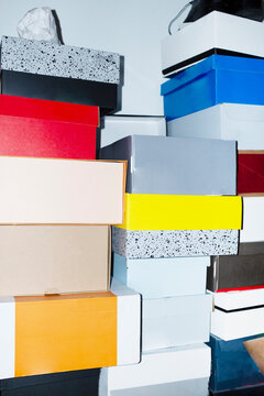 Colourful cardboard delivery boxes with  direct flashlight in office