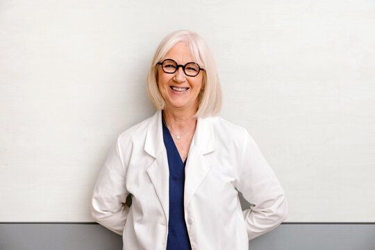 Confident senior doctor woman with a warm smile