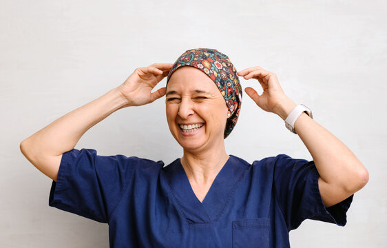 Joyful Healthcare Professional in Patterned Scrub Cap