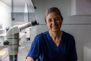 Smiling Female Scientist in Laboratory