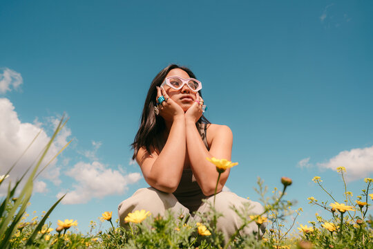 Trendy asian teen in a spring field