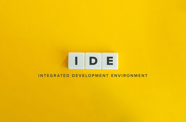 Integrated Development Environment (IDE) Acronym.
Block Letter Tiles on Flat Background. Minimalist Aesthetics.