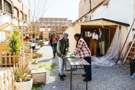Volunteers working together in community garden