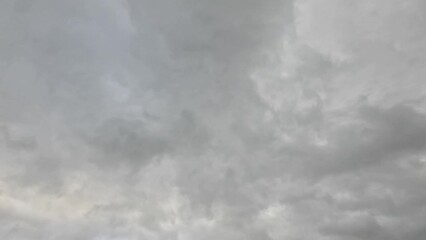Timelapse of gray stormy clouds movement on a gloomy day