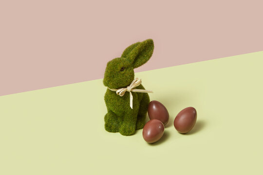 Rabbit shape figure isolated in studio with easter choco treats
