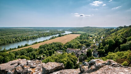 Aerial view of a village and river seen from a hilltop