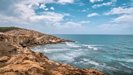 Scenic view of a rocky coastline against the sea