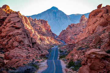 Scenic road meandering through the majesty of the orange landscape of Valley of Fire Nevada - Powered by Adobe